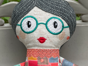 A close up of my grandma doll's face.