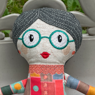 A close up of my grandma doll's face.