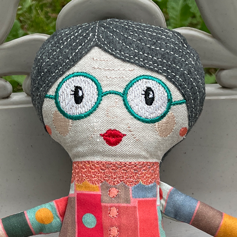 A close up of my grandma doll's face.