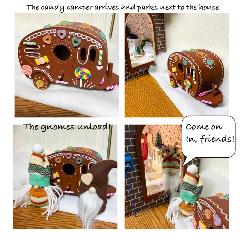 A little camper trailer painted gingerbread brown, festooned with various candies and icing decorations. 